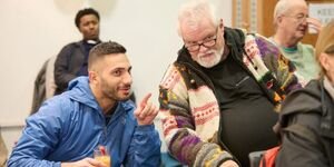 volunteer speaks to a member of the public