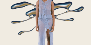 Image of a woman modelling a purple shirt and trousers.