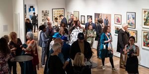 Image of a crowd in a gallery.