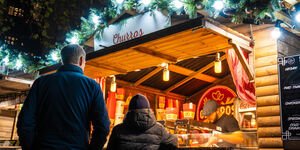 Image of a father and son buying Churros.