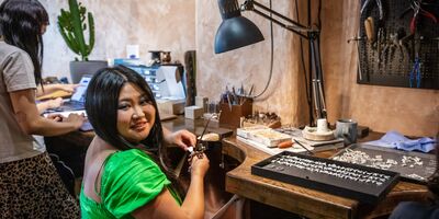 An image of Loveness Lee working in her studio.