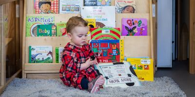 baby reading a book