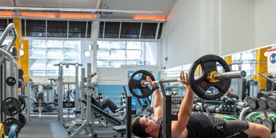 An image of a man lifting weights in Colombo gym.