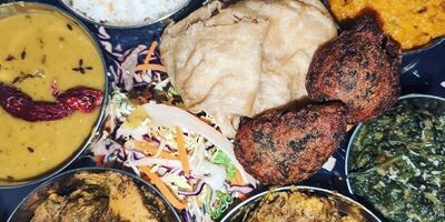 Image of a Trini Thali platter of dishes.