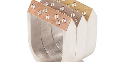 Image of a set of three rings in gold, yellow and rose gold.