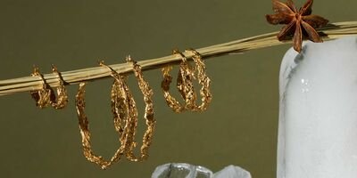 Image of a set of gold hoop earrings.