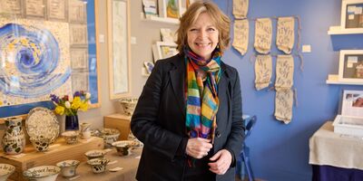 Liz smiling in her shop.