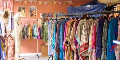 Image of a clothing rack in a shop.
