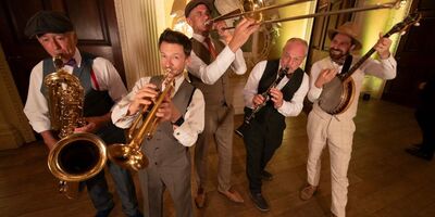 A group of musicians playing brass instruments 