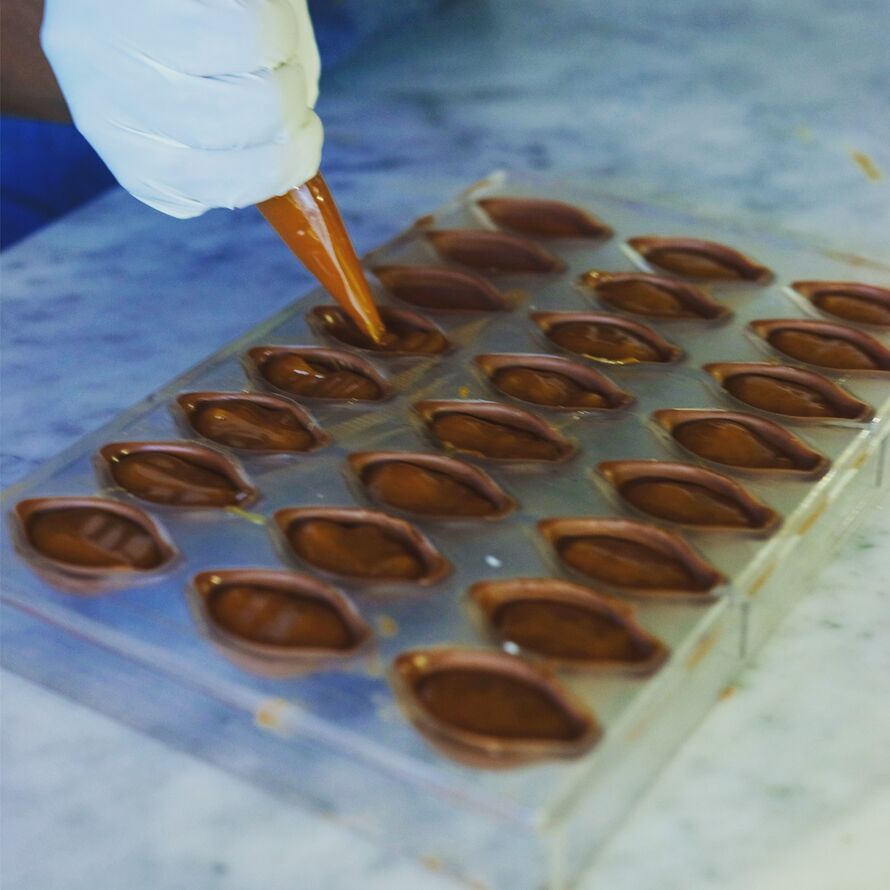 Image of Lisette making the chocolate.